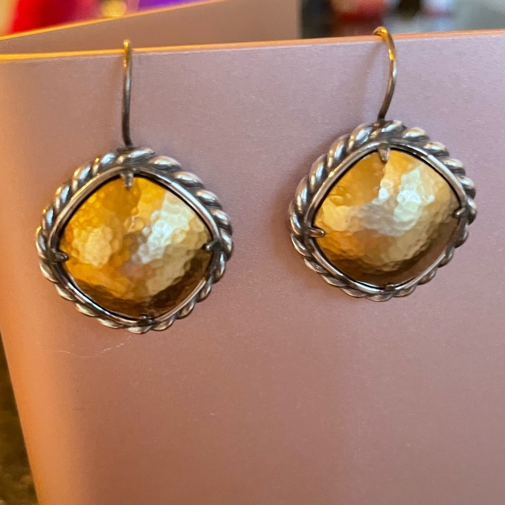Twisted silver frame around brushed gold dome - the ultimate work earring